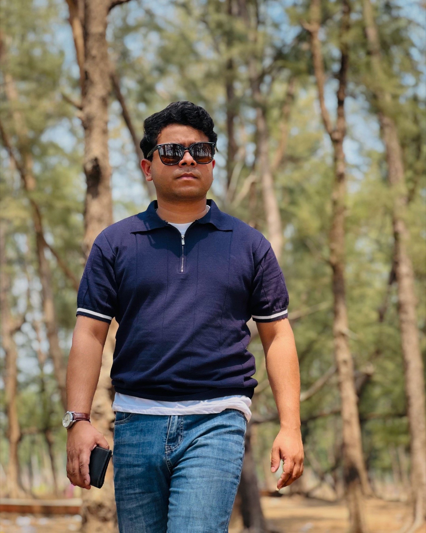 Hasnat Jani Rafin walking outdoors in a campus-like setting