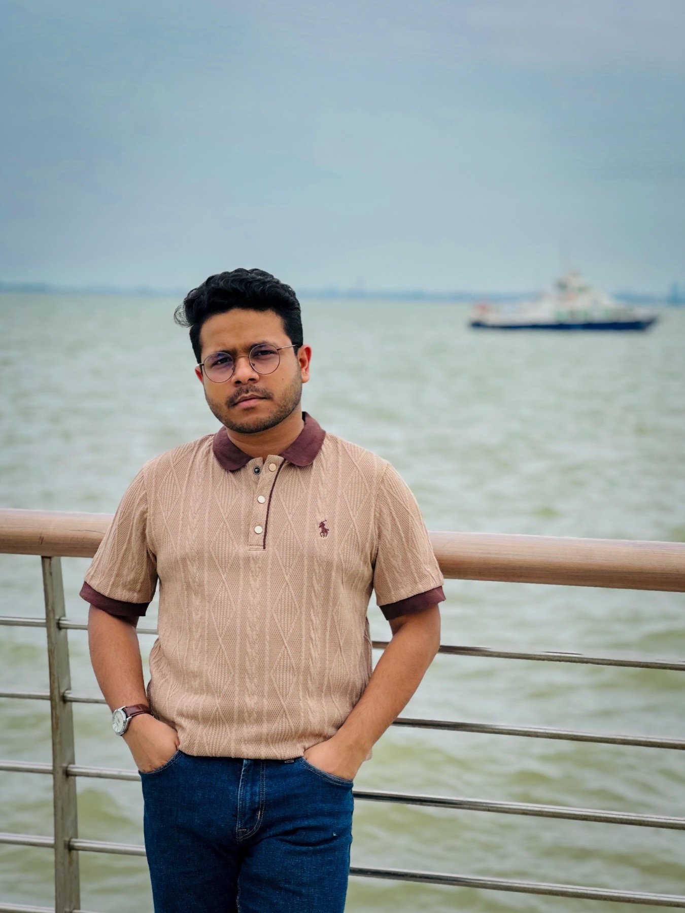 Hasnat Jani Rafin in an outdoor academic setting wearing sunglasses
